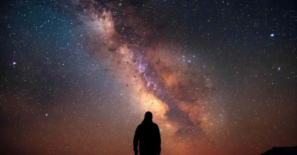 Astrophotography-themed cosmic night sky with Milky Way and glowing starlight.